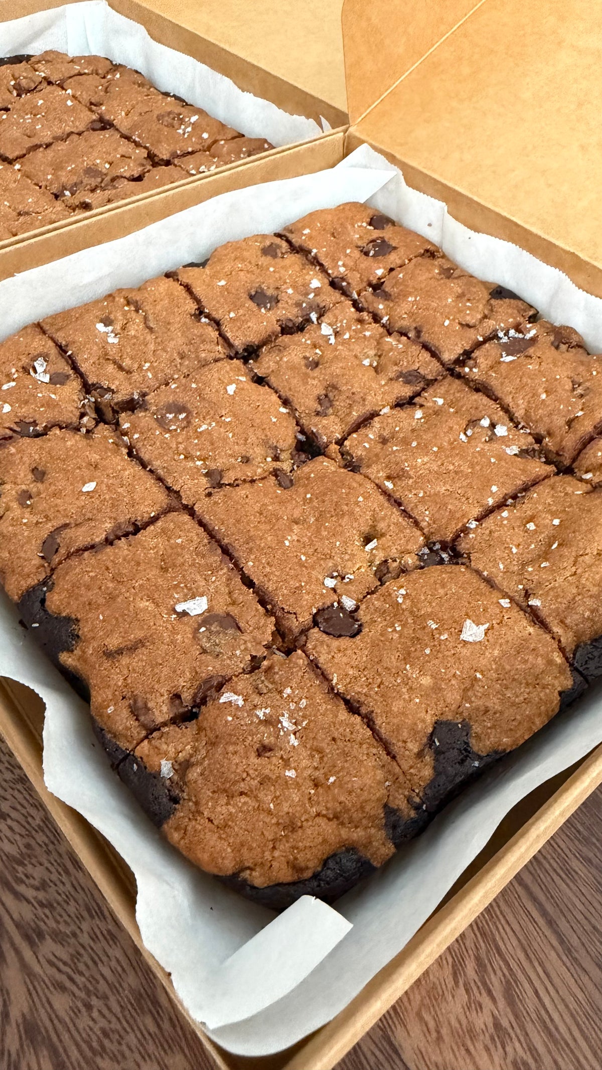 Close-up of dark chocolate sea salt brookies in a box
